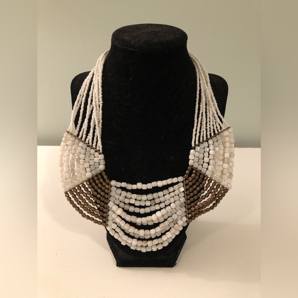 Bohemian layered white and gold beaded necklace.